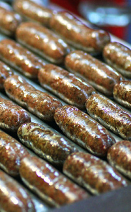 sausages on a roller-cooker